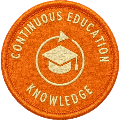 Embroidered Knowledge patch — a graduation cap inside a learning loop on orange